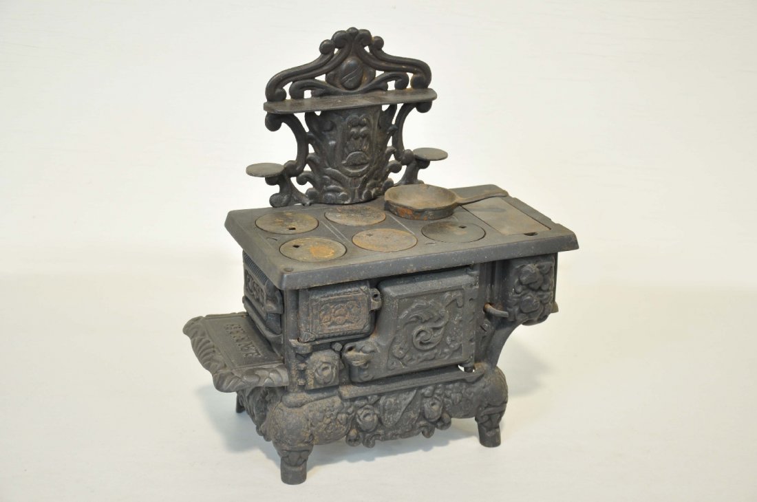 Early Cast Iron Giant Childs Stove: Circa 1900. Painted cast iron 12 X 6 X 14". It appears to have most of the main parts, plus a cast iron frying pan. It show moderate playwear, but should clean nicely, C6