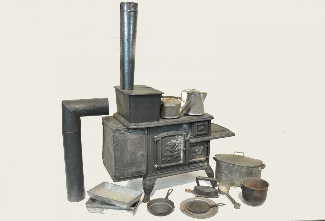 1867 Charter Oak Salesman's Sample Stove: Model 30, by G.F. Finnley, St Louis MO, made soon after the Civil War. Painted cast iron, 23 X 11 X 17"T plus the 29" stove pipe. It appears 90% complete with inside grates and many added accessories