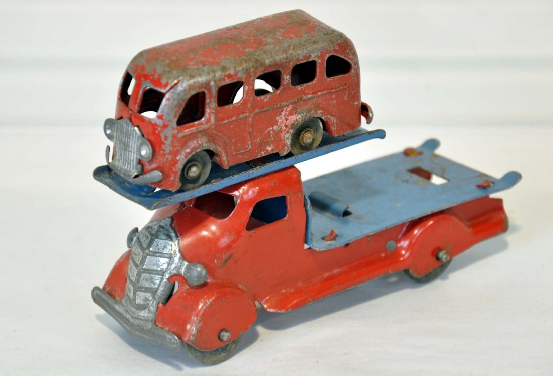 Early Marx Auto-Loader Truck: 6 1/2" painted pressed steel truck with tin grill; It shows light to moderate playwear, C7, with a 3" bus, showing heavy playwear, C3
