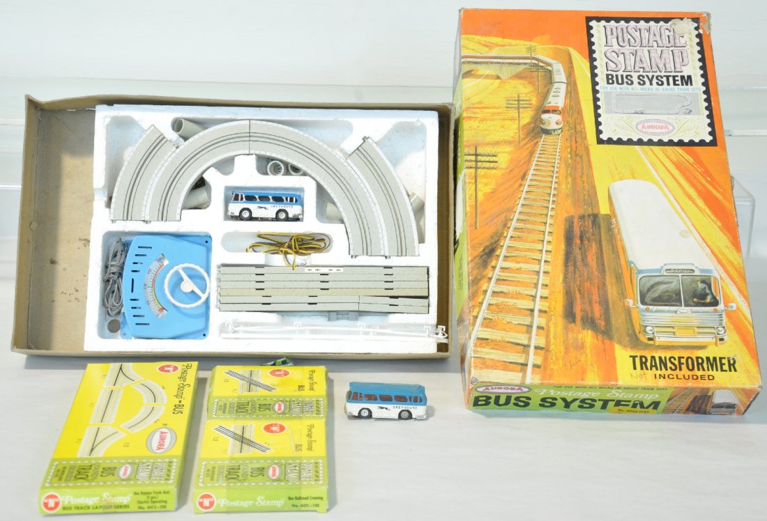 Boxed Aurora Bus Slot Car Set: Marketed for N gauge, but is perfect HO size. Set 4404-1595. Includes 2 busses and enough track to complete the insert, plus. Also includes 4413-350 Bypass set, ob; 2 4421-50 Railroad Crossings(N Gaug