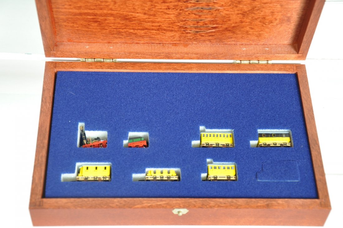 Railex Z Gauge Brass 8770A Adler Set: Very scarce 7-car brass set sold through Marklin dealers, equipped with a sound module car. It includes its wood display case and sleeve. It is like new, C9-10