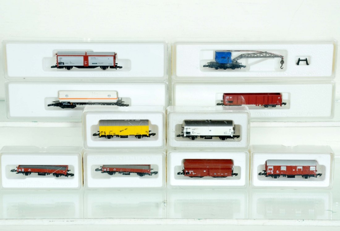10 Marklin Z Gauge Assorted Freight Cars: Includes 8621 crane; 2 #8610 flats; 8608 tanker; 8623 slide door goods wagon; 8650 open; 8606.3 goods; 8600 reefer; 8685 hopper; 8605.2 stock car. All appear like new with boxes, C9-10