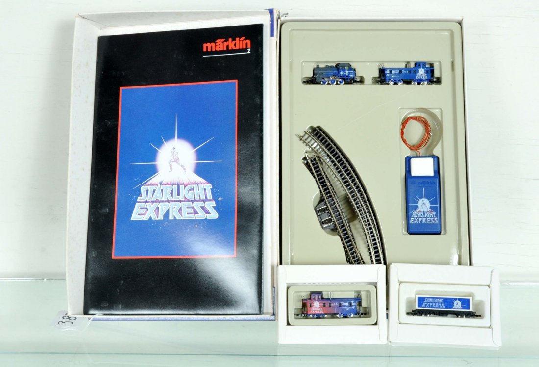 Marklin Z Gauge Starlight Express Set: Includes the complete starter set, loco, caboose track & controller; Plus a matching container car & additional caboose. All appear like new with shop worn boxes and paperwork, C9