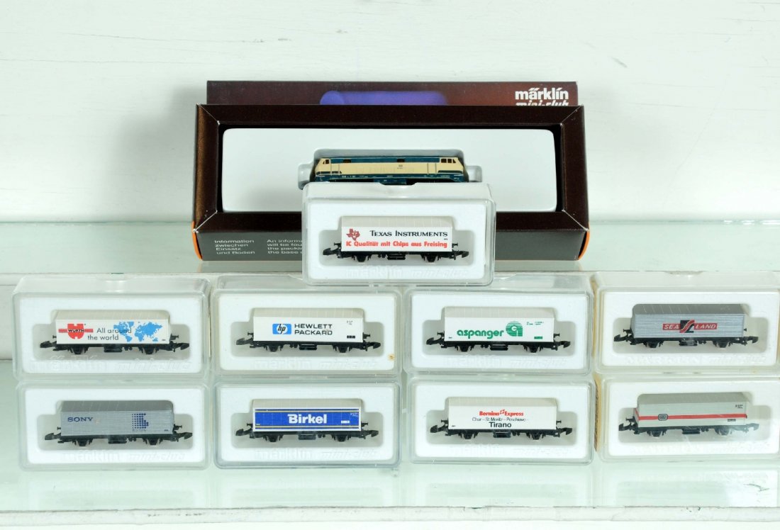 10Pc Marklin Z Gauge Diesel Freight Set: Includes a 8874 DB diesel, body is loose, no visible damage; Container cars- 8617 BER; 8617 WUR; 8617 BIR; 8615.3; 8617 SON; 8617 ASP; 8617 TI; 8618; 8616.4. Otherwise all appear like new with boxes, 