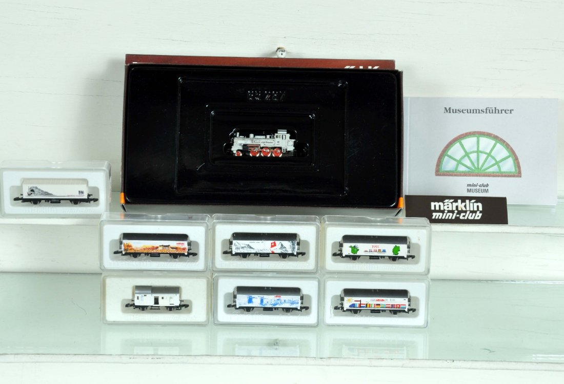 Marklin Z Gauge Mini-Club Set: Includes an 8894 2-6-0 tank loco; freight cars- 2106A; 2108A; 1990 & 1 container cars; 2112A; 2110A; 8609, plus a plastic Mini-Club shelf sign. Trains appear like new with boxes, C9-10
