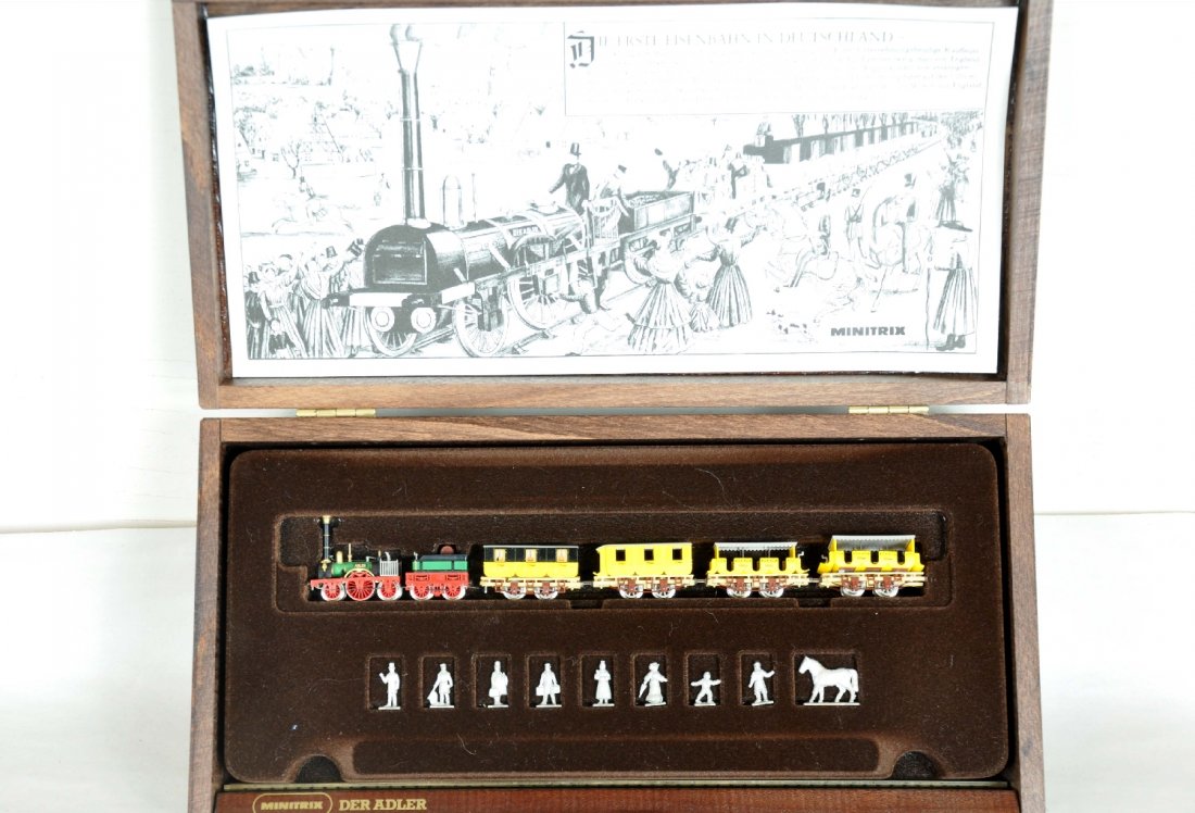 Minitrix N Gauge Adler Set: Super detailed 6-car set with a metal figure set and display stand with track. It is Like new with wood display box, sleeve and paperwork, C9-10, plus an added transformer