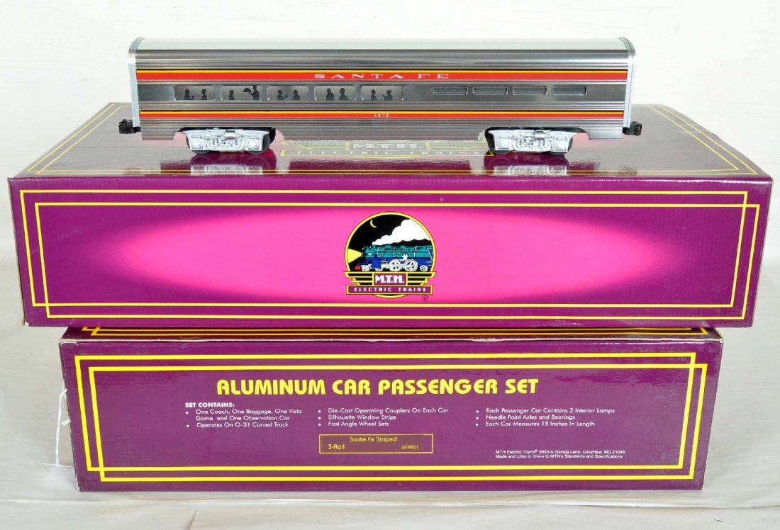 MTH SF Aluminum Passenger Cars: Includes 20-6021 60' 4-car striped set; plus the 20-6121 sleeper/diner set. They show very light runtime with shiny, C9 bodies and set boxes