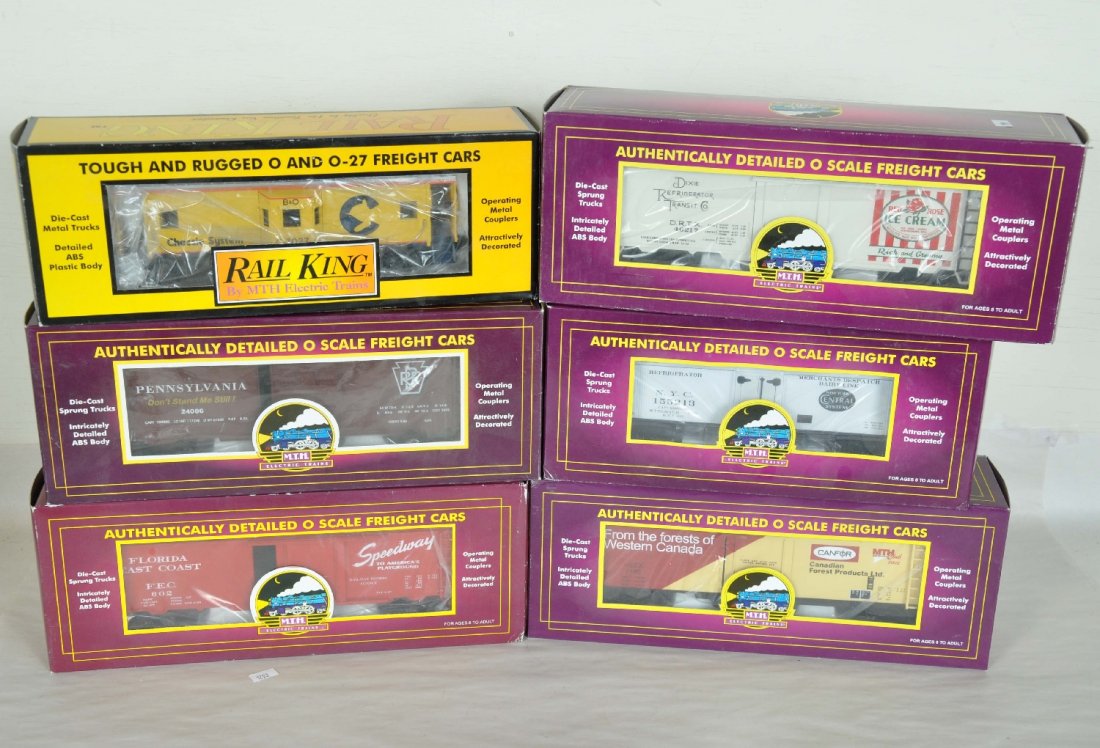 6 MTH Freight Cars: Includes 20-94312 NYC reefer; 20-94028 MTHRRC reefer; 20-94017 Red Rose reefer; 9302L PRR boxcar; 20-94013 FEC reefer; 30-7713 Chessie caboose. Most are unrun with boxes 94017 has 3" tear in flap. Per