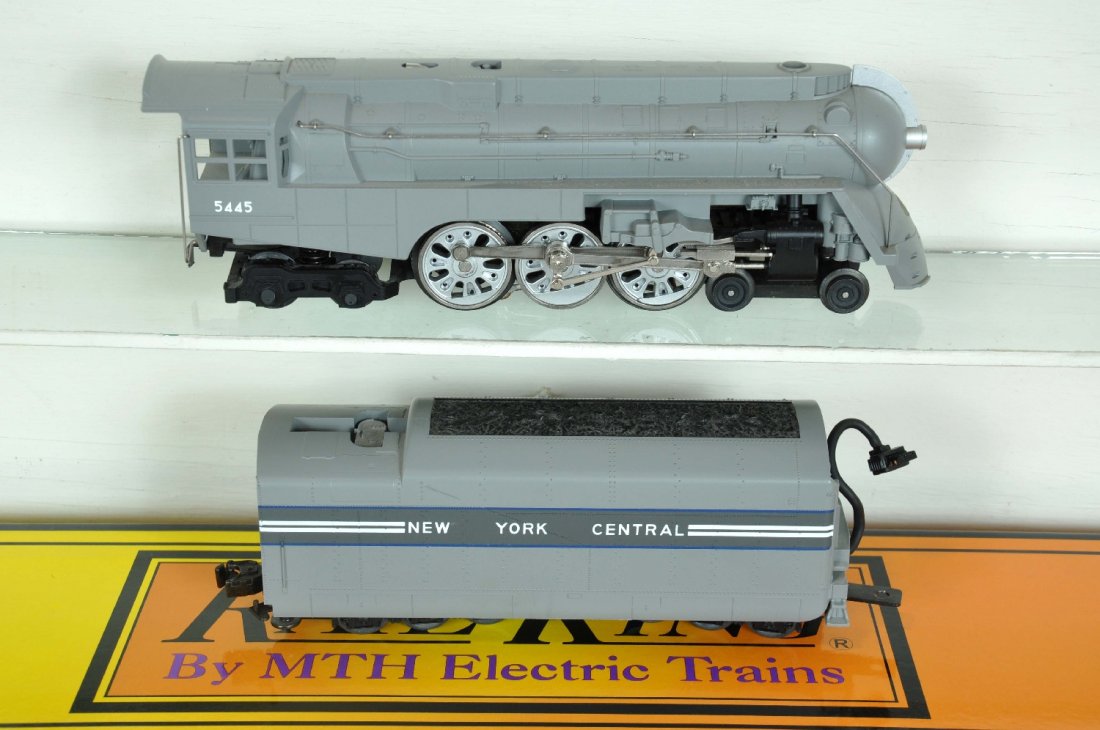 MTH RailKing 1113LP Dreyfuss Hudson: Nice streamline loco & tender with ProtoSounds 1. It needs its rubber drive tires, but has a nice box. Perfect paint and trim. Wheels show light to moderate run time. C8