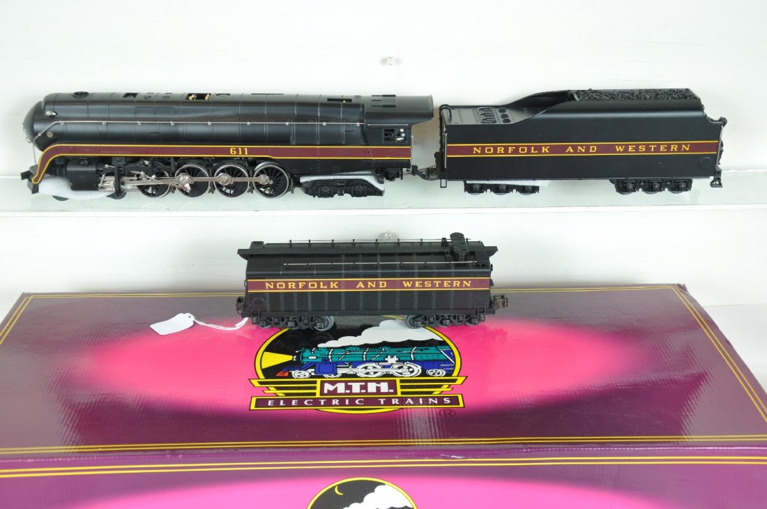 MTH 20-3024-1 N&W J with Aux Tender: 054. Nice scale 4-8-4 streamline steam loco with ProtoSounds. It has a nice box, plus an unboxed Auxiliary tender. Perfect paint and trim. Wheels show light to moderate run time. C8