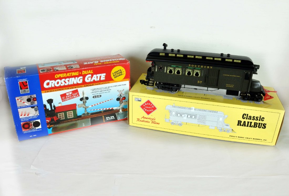 2 Pc G Gauge Lot: includes boxed #1964 Life-Like Train Operating Crossing Gate, and Aristocraft # ART-83104 Southern Classic Railbus. Loose door and door guide 1 side. Otherwise perfect paint and trim. Wheels show ligh