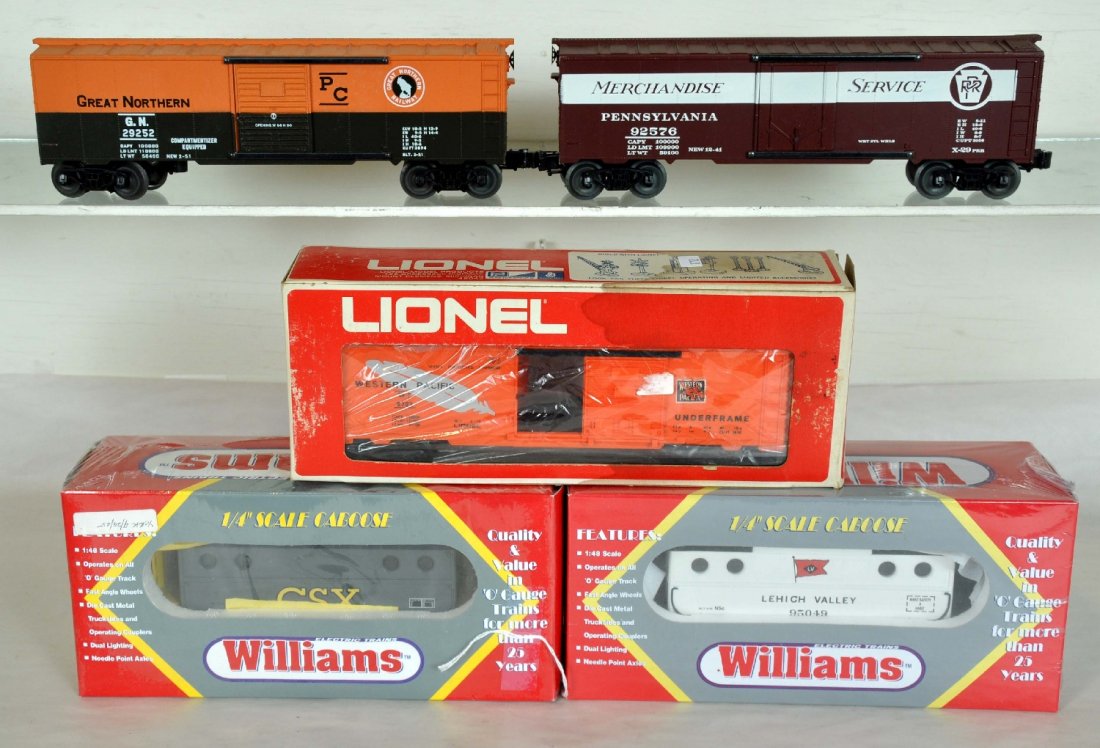 5 Modern Freight Cars: Includes Williams LV and CSX N5c cabooses sealed in boxes; Lionel 9723 WP boxcar; KMT PRR & GN Boxcars. All have boxes. Perfect paint and trim. Wheels appear test track run. C9