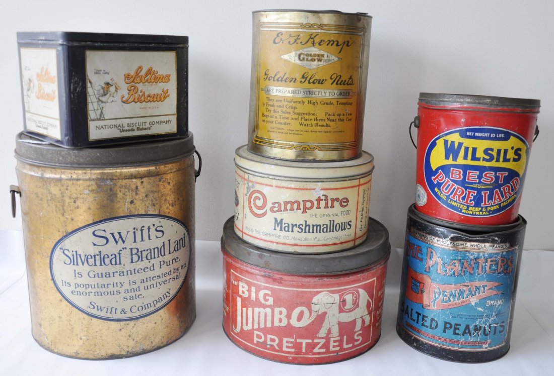 7 Larger Country Store Food Tins: Includes a 14 1/2" Swift's Lard; Scarce Jumbo Brand Pretzels; National Biscuit(Nabisco) Saltina tin with a great Sailor image; Campfire Marshmallows; Pennant and golden Glow Peanut tins and a Wilsons