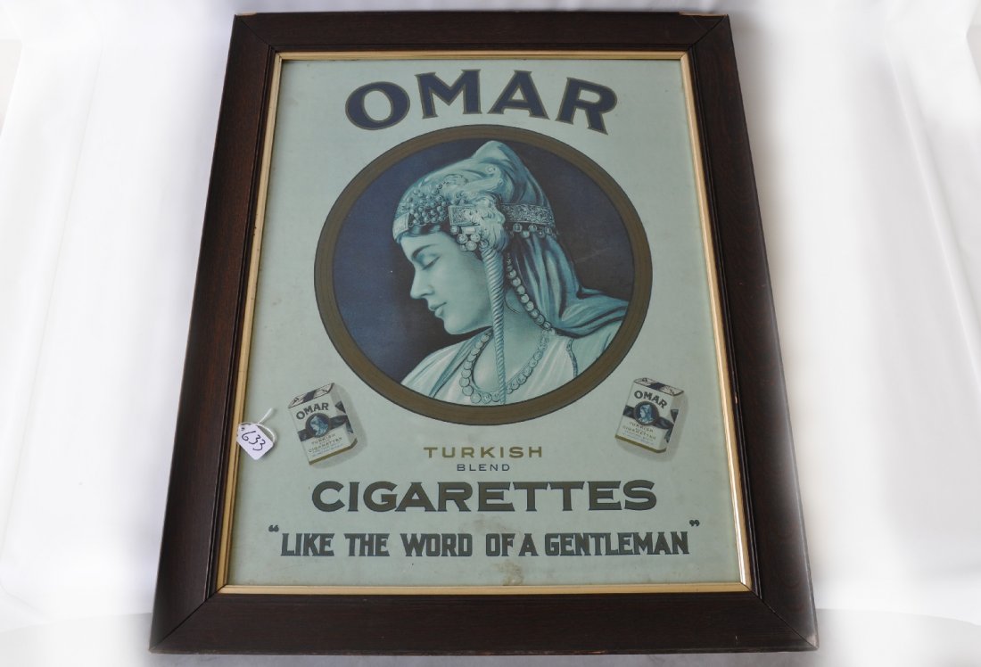 Large Omar Cigarettes Tobacco Sign: 33 1/2 X 27 1/2" paper litho framed sign. It has nice color showing a few light stains. It is matted and framed in oak under glass, frame shows corner damage. Strong graphic image