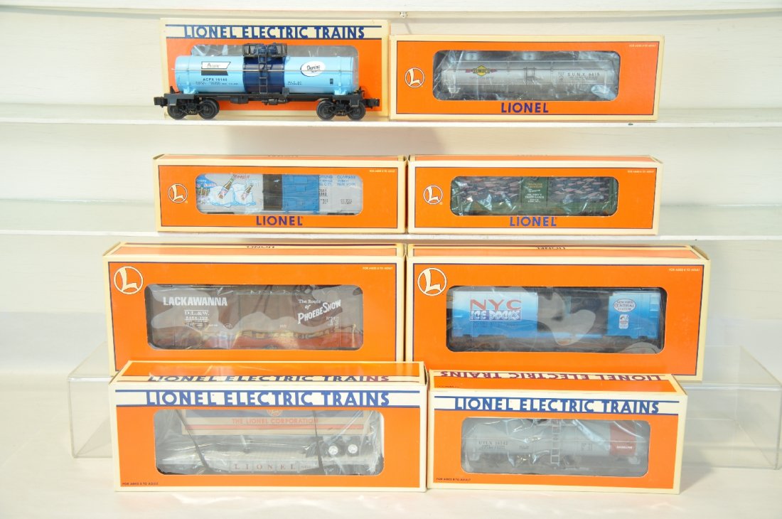 8 Lionel Freight Cars: Includes 16742 aquarium; 16140 tank; 16142 tank; 16152 tank; 19832 ice car; 16924 trailer flat; 16767 ice car; 29260 boxcar. They show light runtime with C9 bodies & boxes