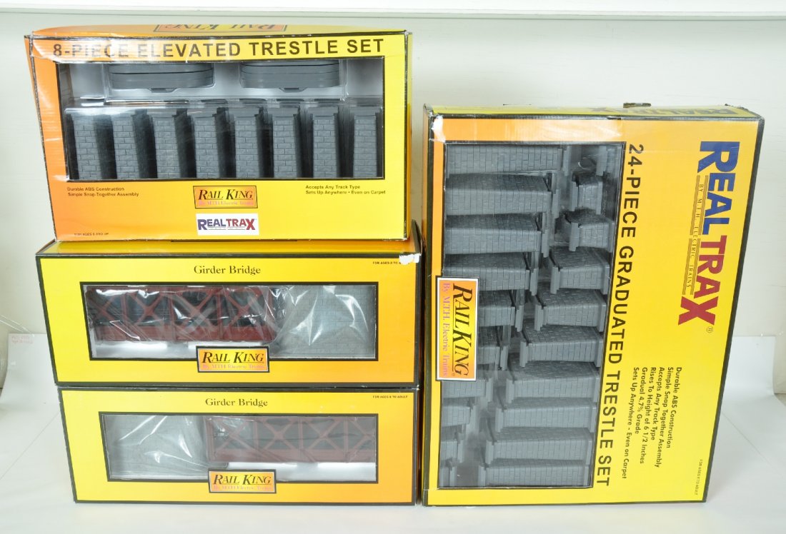 4 MTH RailKing Bridge & Trestles: Includes 2 #40-1032 Rust Girder Bridges; 40-1033 24pc Trestle system; 40-1034 8pc Elevated trestle set. All appear like new with boxes, 1 shows wear. C9