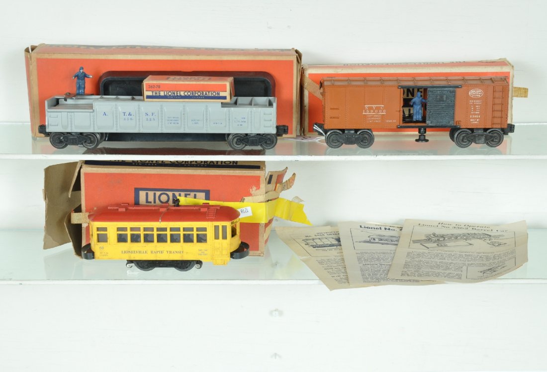 3 Boxed Lionel Cars: Includes a 3562-25 barrel car with -78 barrels, instructions and insert, showing light wear ob, C7+; 60 Trolley, blue lettered, needs a cleaning with rough ob & instructions, C5+-6; 3464 NYC operating