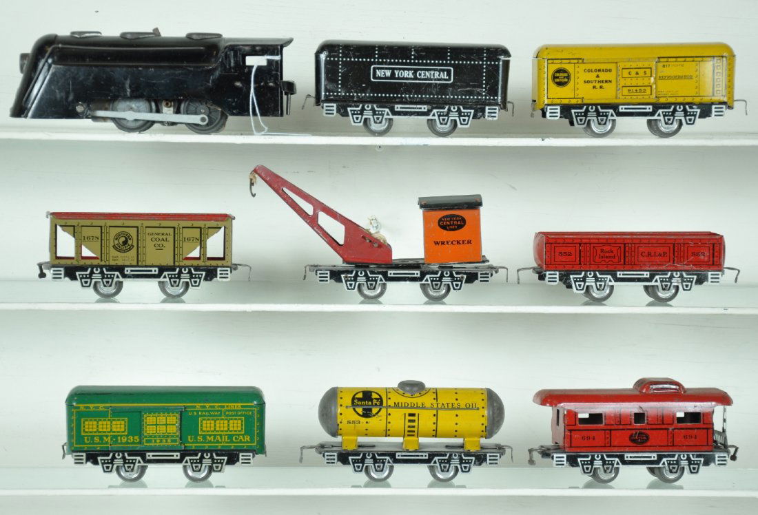 Nice Pre War Marx Freight Set: Early set with joy Line couplers. Includes CV loco with swing pin; NYC tender; C&S reefer; hopper; Scarce mail car; tank car; gondola; crane & caboose, all have silver detailed frames. The set is clea