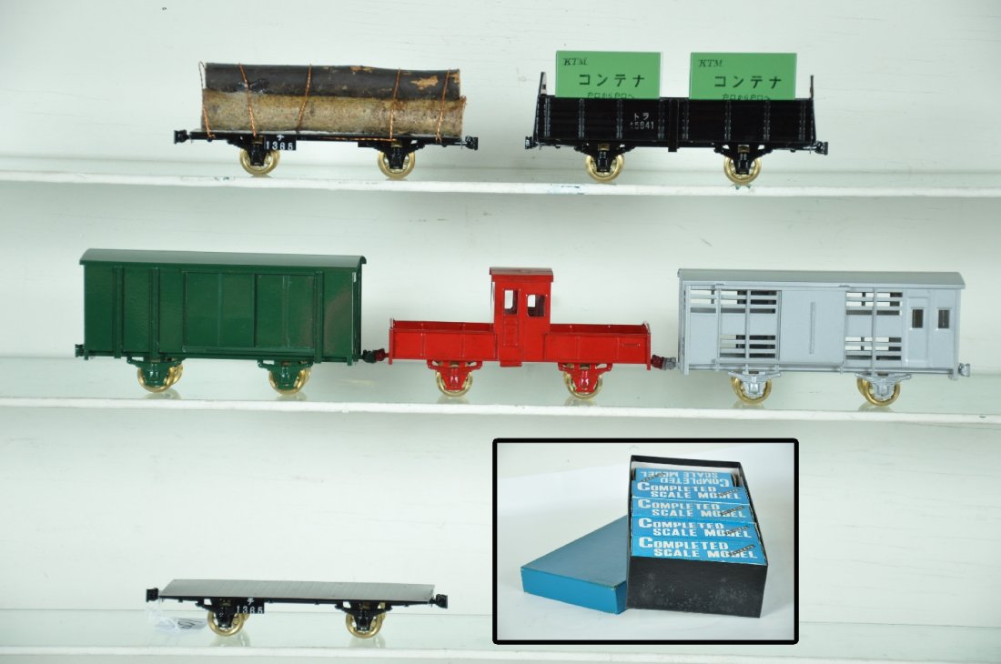 Boxed KTM Brass O Freight Car Assortment: Unusual Japanese domestic production. Includes a factory painted container flat; log car; good wagon; poultry car; flat car & transfer caboose. All are boxed with an unlabeled master box. All appear l