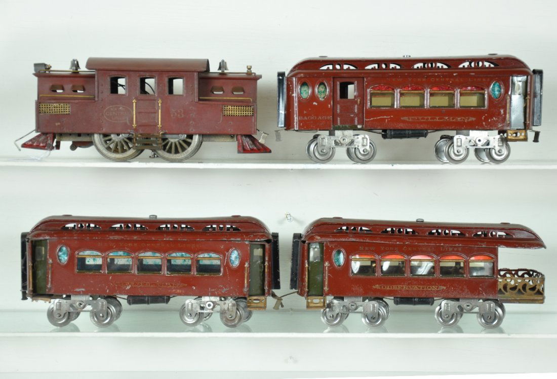 4Pc Lionel 53 Passenger Set: ST. Gauge. Circa 1913. Includes a square cab 53, 0-4-0 electric, clean with good lettering, but paint has crazed and has a satin look; 180 combine; 181 coach; 182 observation. Cars are nice and shiny