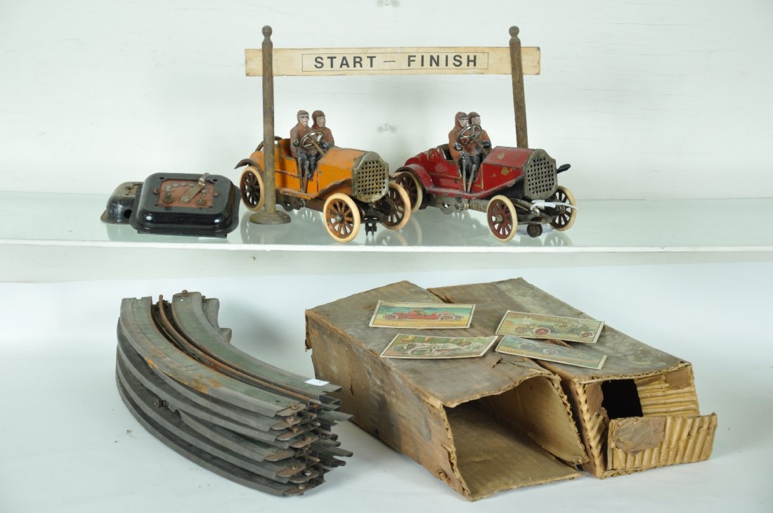 Scarce Lionel 84 Double Racing Set: America's first slot car set! Circa 1912. This is the deluxe set with two lanes of racing fun. It includes the RARE Finish Line sign and has both original cars. They both have repaired figurers and th
