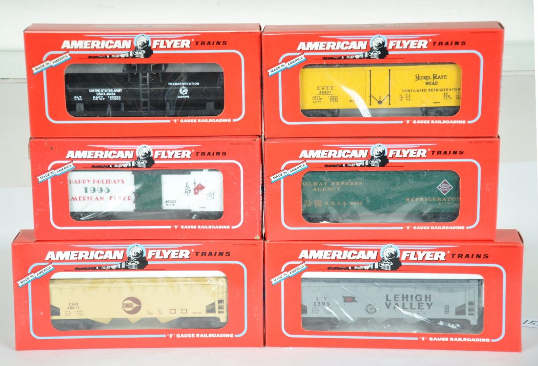 6 Lionel-American Flyer Freight Cars: S Gauge. Includes 48611 Cargill hopper; 48494 NASG LV hopper; 48323 1993 Xmas boxcar; 48806 REA reefer; 48404 UA army tank flat; 48807 NPR reefer. All appear new in boxes, C10