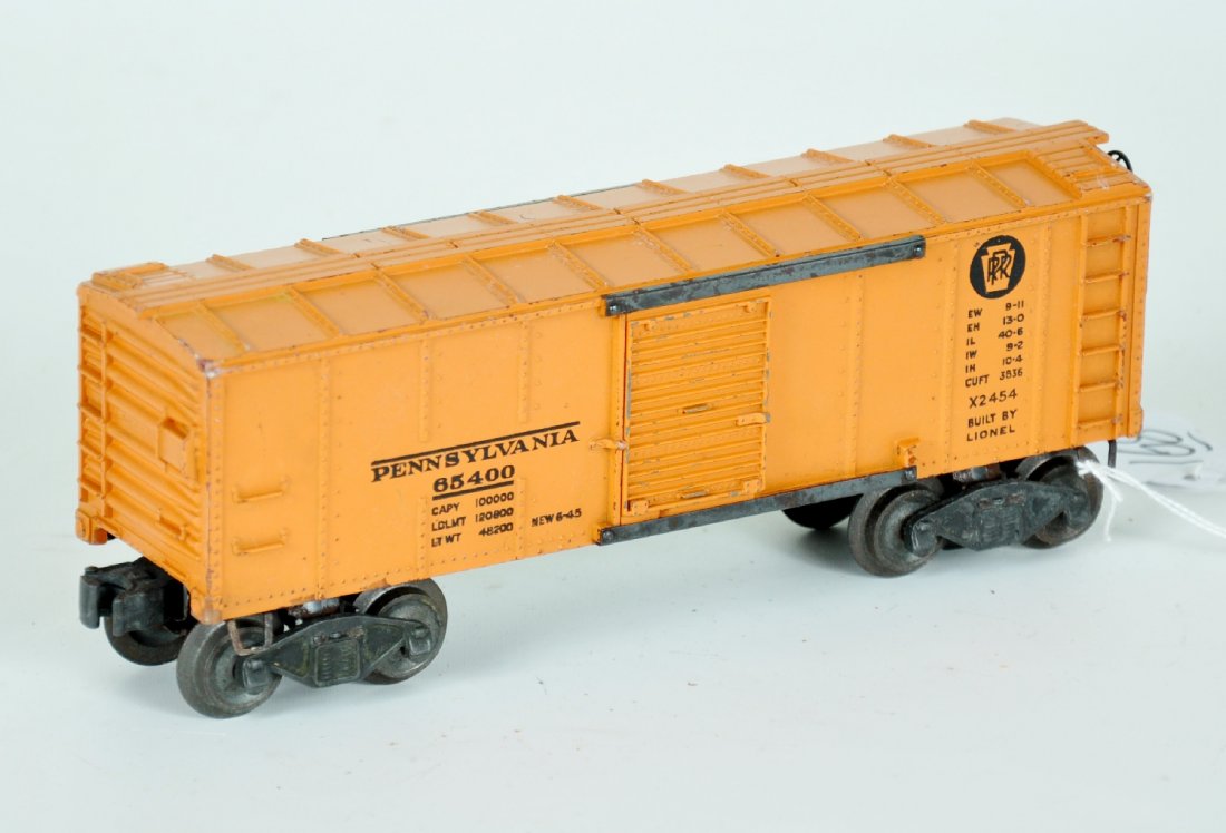 Scarce Lionel 2454 PRR Boxcar: Tougher orange painted door version. It is very clean with late flying shoe trucks. It shows moderate playwear, C5+-6 Tough variation