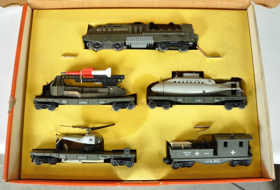Boxed Lionel 1805 Land, Sea & Air Set: Very desirable 1960 Set. Includes a 45 USMC loco with missile launcher, with 4 rockets, steps intact, just a few rubs from sitting in set box; 6640 ICBM launcher; 3820 flat with Navy sub; 3829 operati