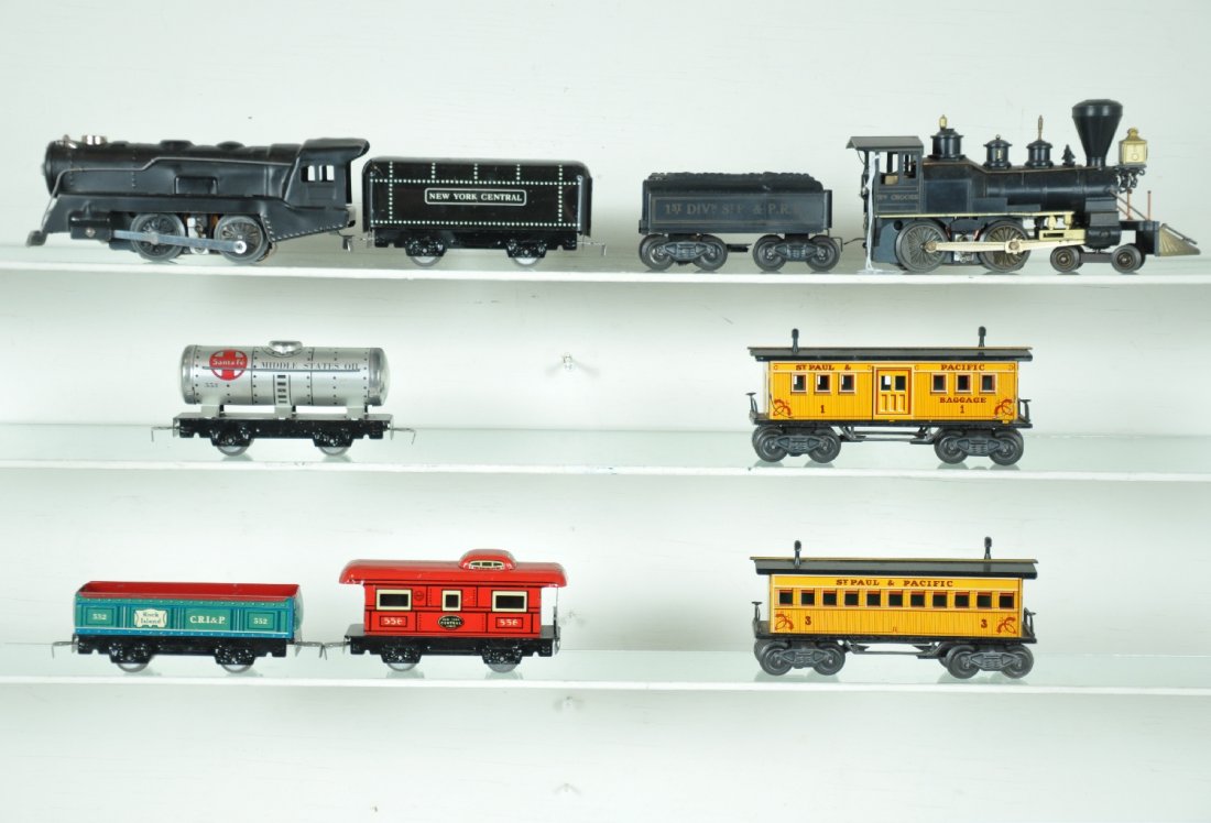2 Marx Steam Train Sets: Includes a Wm Crooks loco, 1 broken handrail stanchion; 1st division tender, nice lettering; baggage & coach, both lettered St Paul & Pacific; 398 loco; NYC tender; tank car; gondola & caboose. All sh
