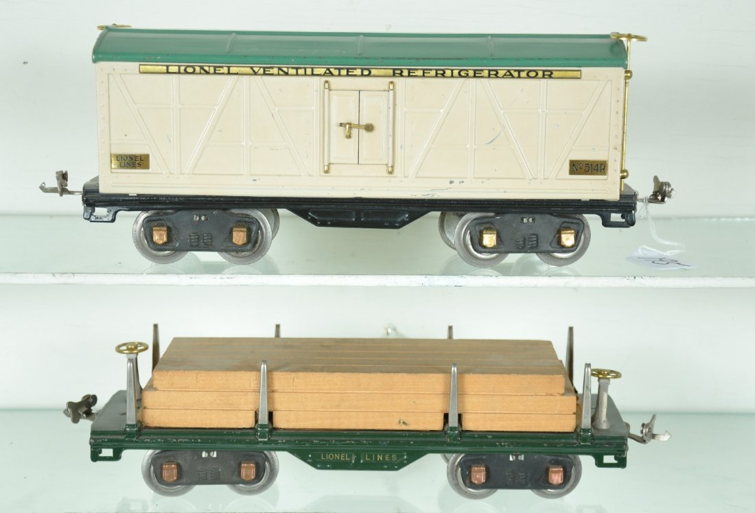 Clean Lionel 514R & 511 Freight Cars: ST. Gauge. Includes a 514R reefer with sides having nice matte patina. It shows light to moderate playwear, C6+; 511 Lumber car, clean and shiny with nice lettering. The load is original and still has
