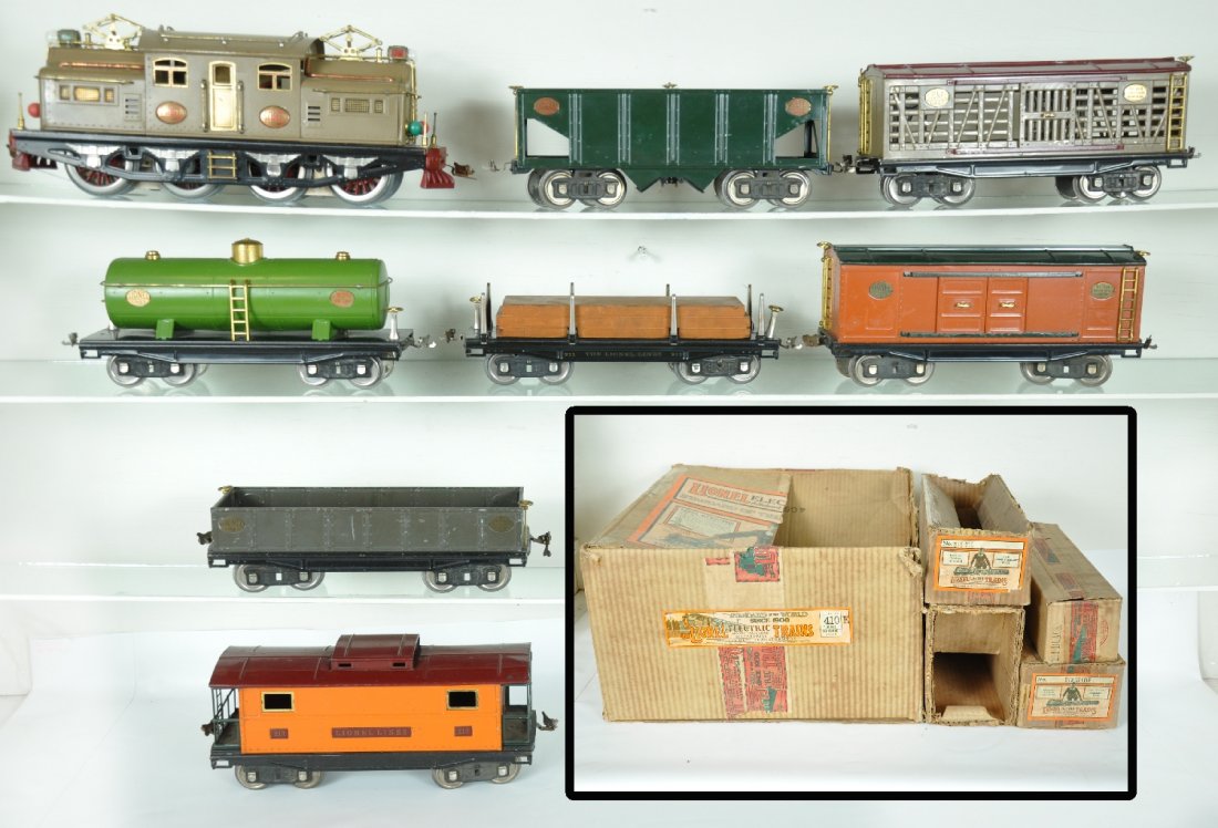 Boxed Early Lionel Set 410E: ST. Gauge. 1st set box we have seen for this set! Includes a mojave 408E dual motor electric, clean satin patina, rewheeled and rewired, ob with liner. There is a slight separation in corner joints, b