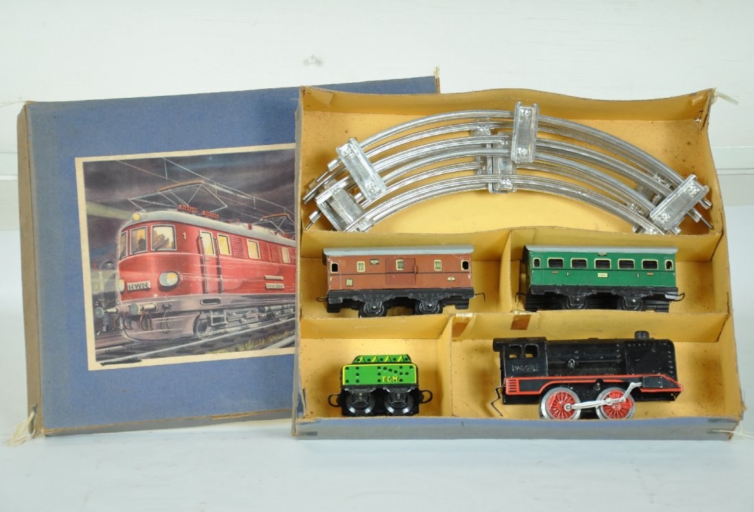 Boxed Karl Bub Train Set: US Zone Germany, O Ga. Includes W48 steam loco, mechanism functions; FCM tender; 36540 coach; 36541 baggage car. Includes track & set box. Trains are like new C9