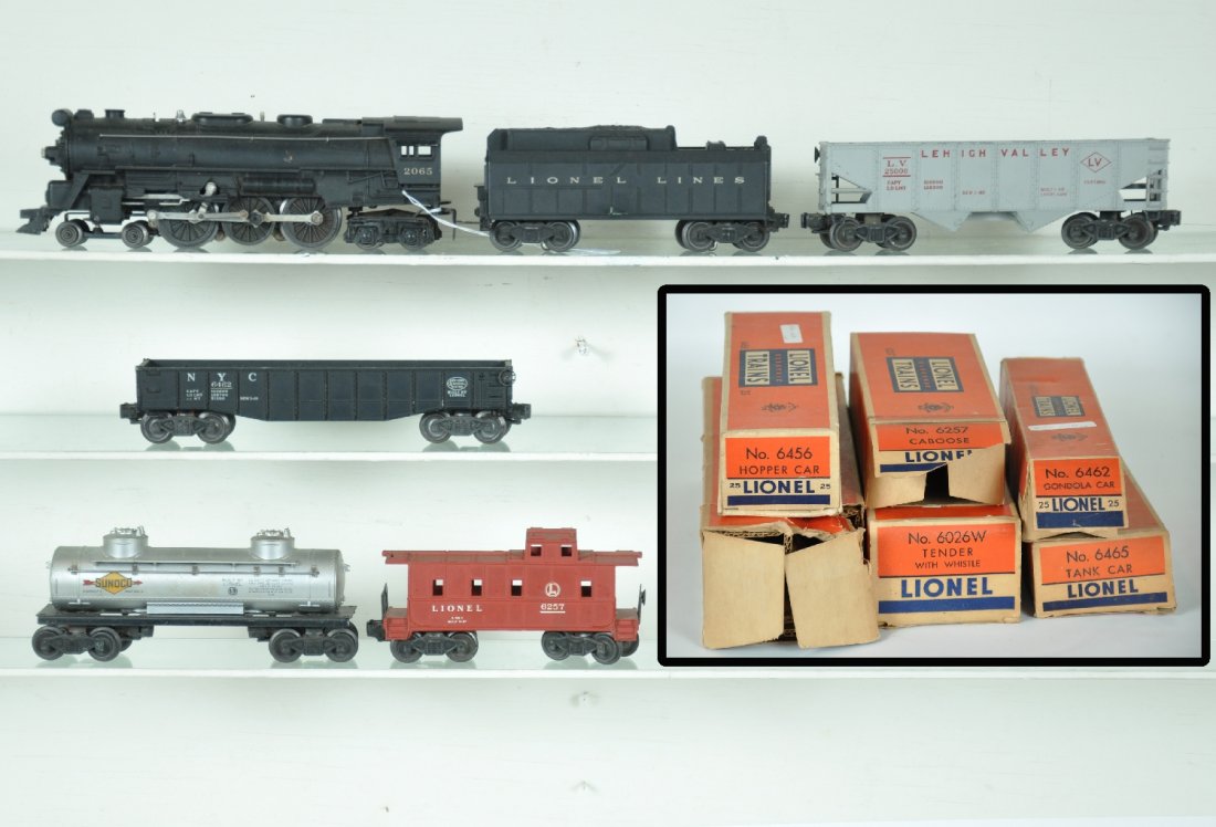 Boxed Lionel 2065 Steam Freight Set: Includes a 2065 4-6-4 locomotive, fairly clean with matching 6026W whistling tender; 6462 gondola; 6465 Sunoco tank car; 6456-25 hopper, light flaking at lettering 1 side, C5; 6257 caboose. All show l