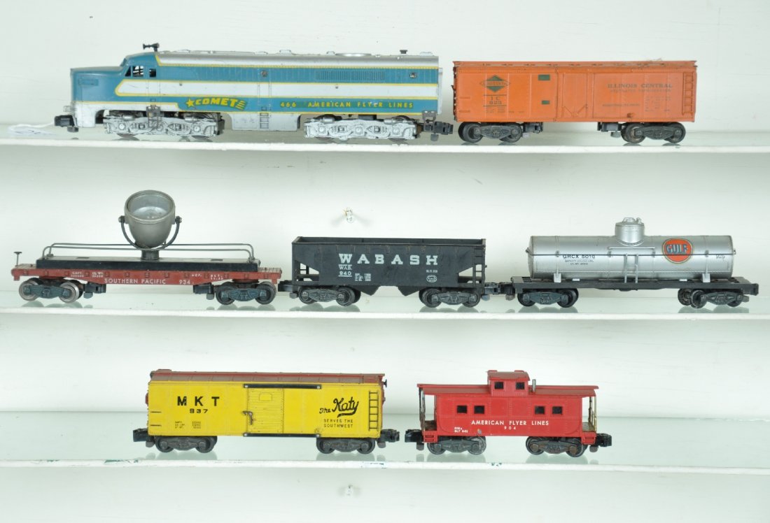 7Pc American Flyer Diesel Freight Set: S Gauge. Includes a 466 Comet PA Alco A diesel; 923 IC reefer; 925 Gulf tank car; 940 Wabash hopper; 934 SP searchlight car; 937 MKT boxcar; 904 caboose. All are clean and show moderate playwear, C6