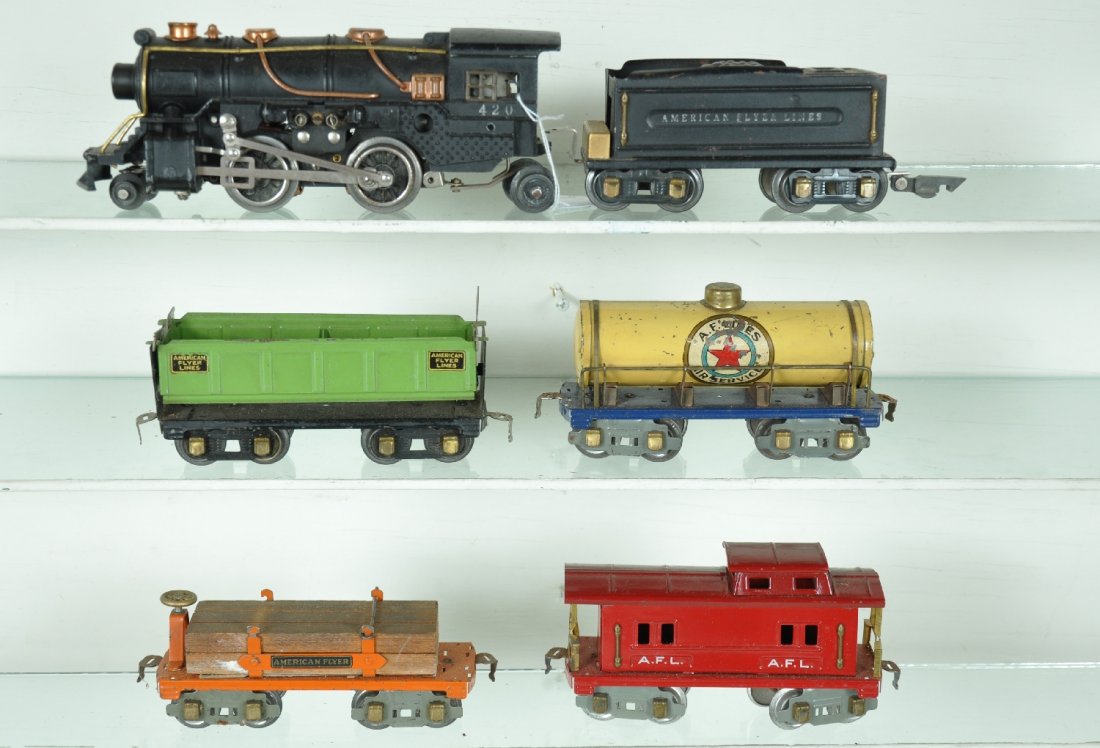 American Flyer Steam Freight Group: Includes a diecast 420 steam loco, wheels turn freely with no fatigue; 421 tender with link coupler, C7; 3046 lumber car; 3018 Air Service tank car, decals 70%; 3017 caboose. Cars show moderate playwe