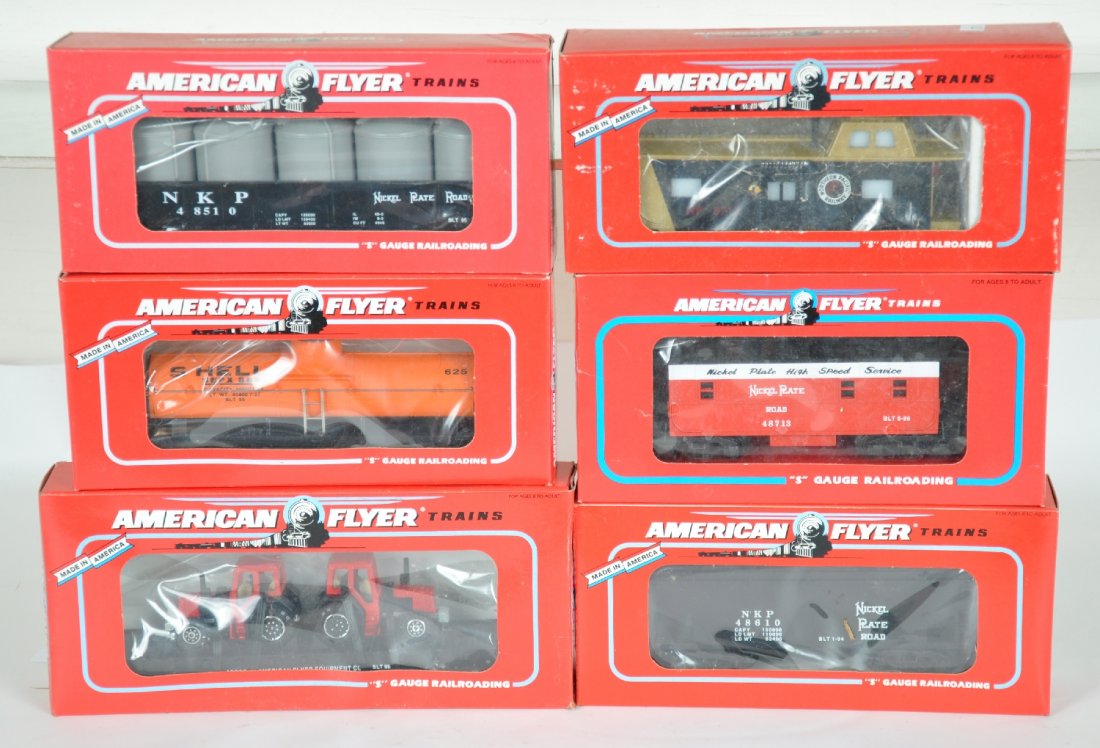 6 Lionel-American Flyer Freight Cars: S Gauge. Includes 48510 NPR gondola; 48711 NP baywindow caboose; 48610 NPR hopper; 48405 Shell tank; 48713 NPR caboose; 48509 flat with tractors. All appear new in boxes, C10