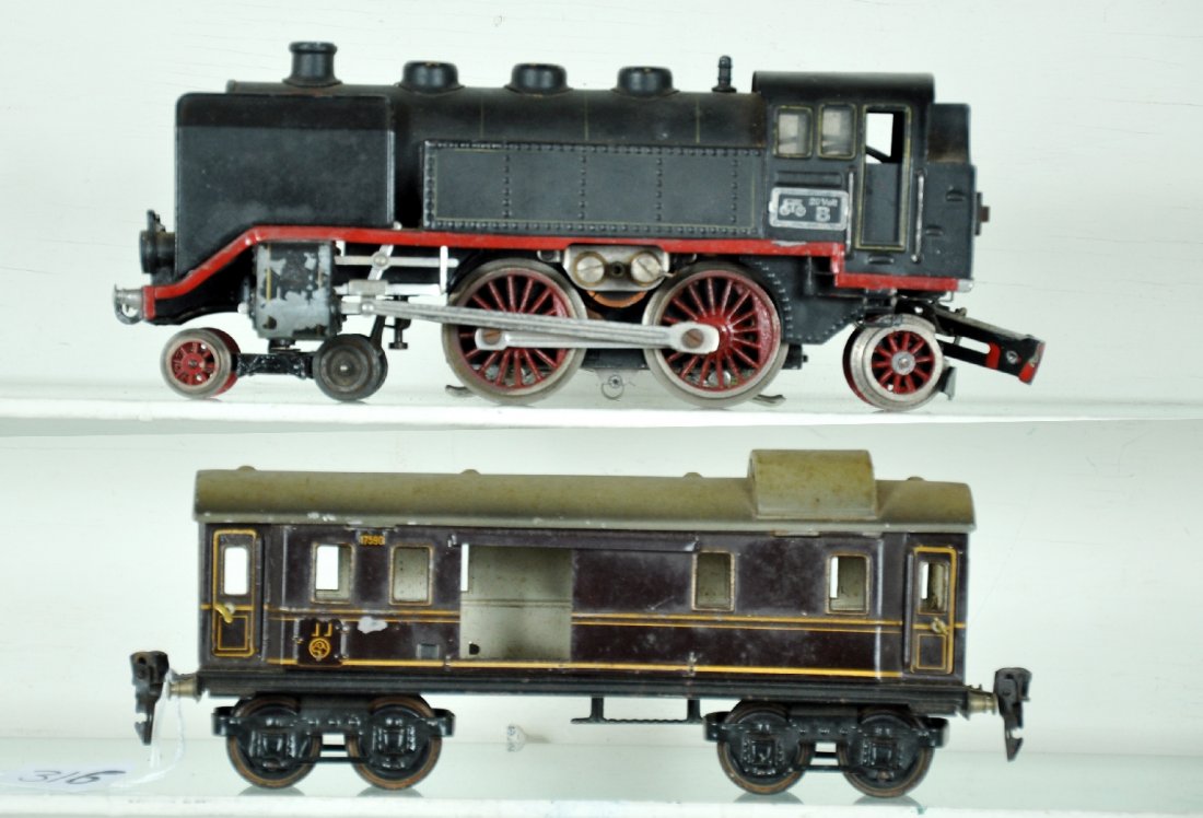 Scarce Marklin 70/12020 & 17590: O gauge. Includes a 70/12020 4-4-2 tank loco; missing 1 windscreen. 2 pony wheels have been replaced rear buffer support needs reattaching; 17590 Rheingold Postal car, missing 1 door. They show modera