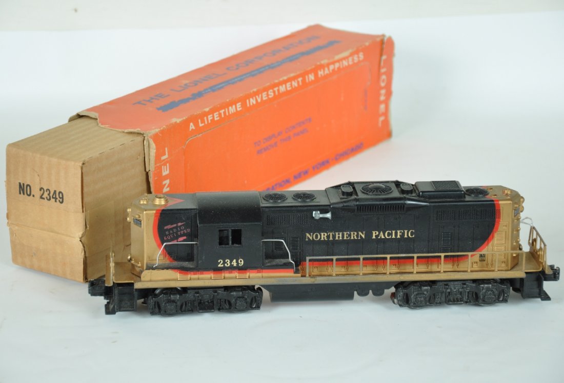 Boxed Lionel 2349 NP GP9 Diesel: Clean bright cab with nice frame with light wear from handling on sides. Owner painted screws gold, but not offensive. Battery box is clean and has original box with intact perf window and scarce slee