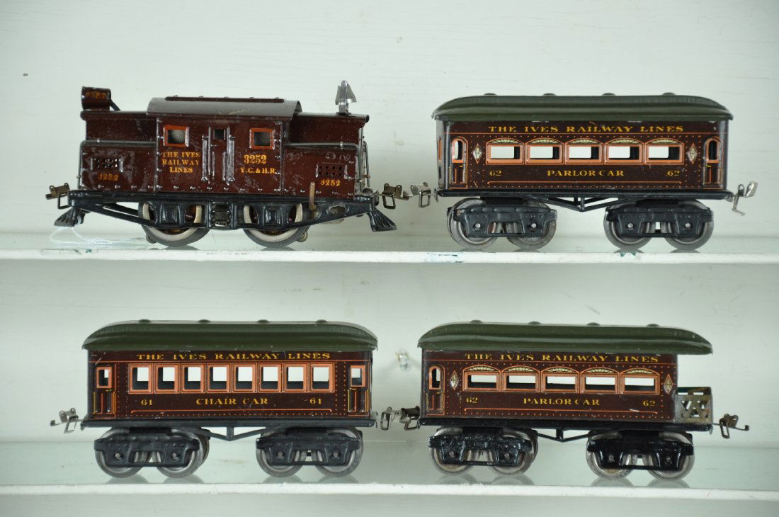 Nice Ives 3252 Passenger Set: Circa 1920. 3252 electric with great gold lettering, some varnish marks from wrapping paper, cast iron frame; 61 chair car; 62 parlor; 62 Parlor observation. Super car roof paint. Very clean & shiny,