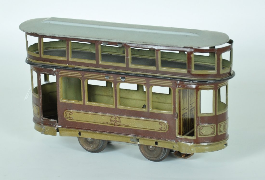 Unusual Haussmann German Trolley: Litho tin double Decker trolley. This floor toy has been modified with a Carette 3-rail electric motor. The litho is clean, showing light to moderate playwear, C7 ish