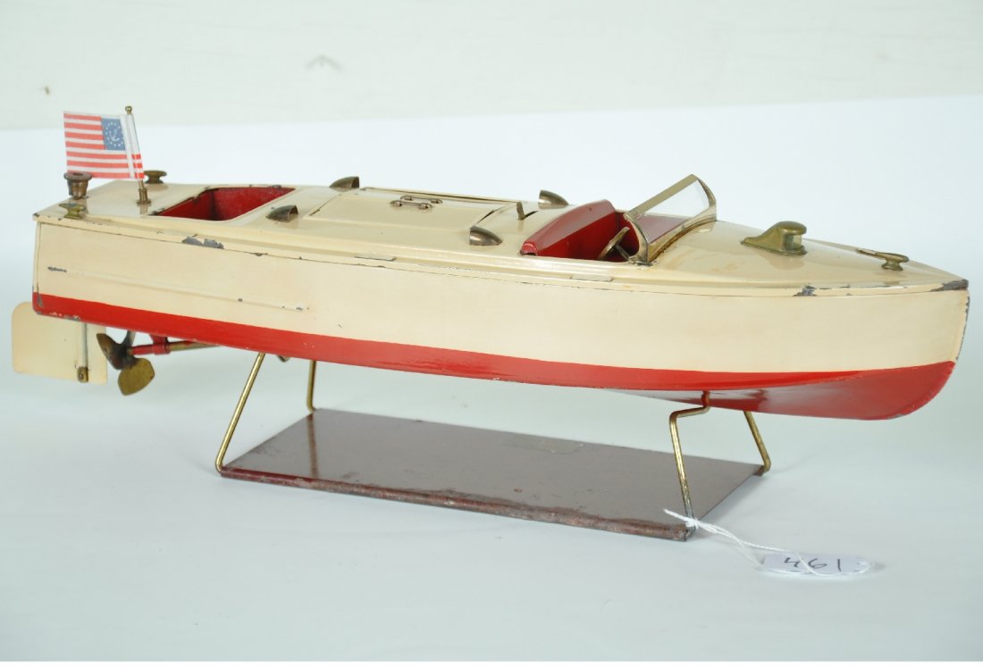 Clean Lionel 43 Pleasure Boat: Circa 1936. clean example with functional mechanism. Castings are original with it's stand. The stand has some edge corrosion, but over-all shows moderate playwear with replaced flag, clean & shiny, o