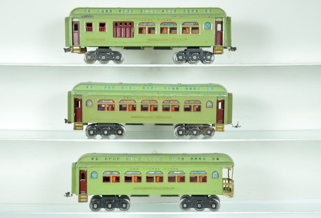 3 Lionel 490 Series Passenger Cars: St. Gauge. Pulled by a 400E, these examples are clean and ready to run. Includes a 419 combine; 418 Pullman; 490 observation. They are clean with some color variance. Interiors appear complete from ou
