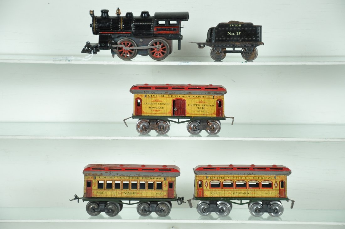 Ives Yale Harvard Set: Includes a 17 steam loco, red highlights added years ago; 17 tender, some oxidation, C5; 60 baggage; 61 Yale chair car; 62 Harvard Parlor. Cars all have green frames, two-tone roofs are not flaking! O