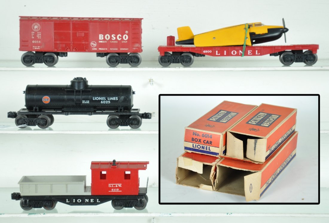4 Boxed Lionel Freight Cars: Includes a 6800 flat with airplane, tougher yellow over black version, no hold-down; 6119-100 work caboose, 1958 ob; 6014 Bosco boxcar, 1958 ob; 6025 Gulf tank car(1615 ob), all show light to moderate