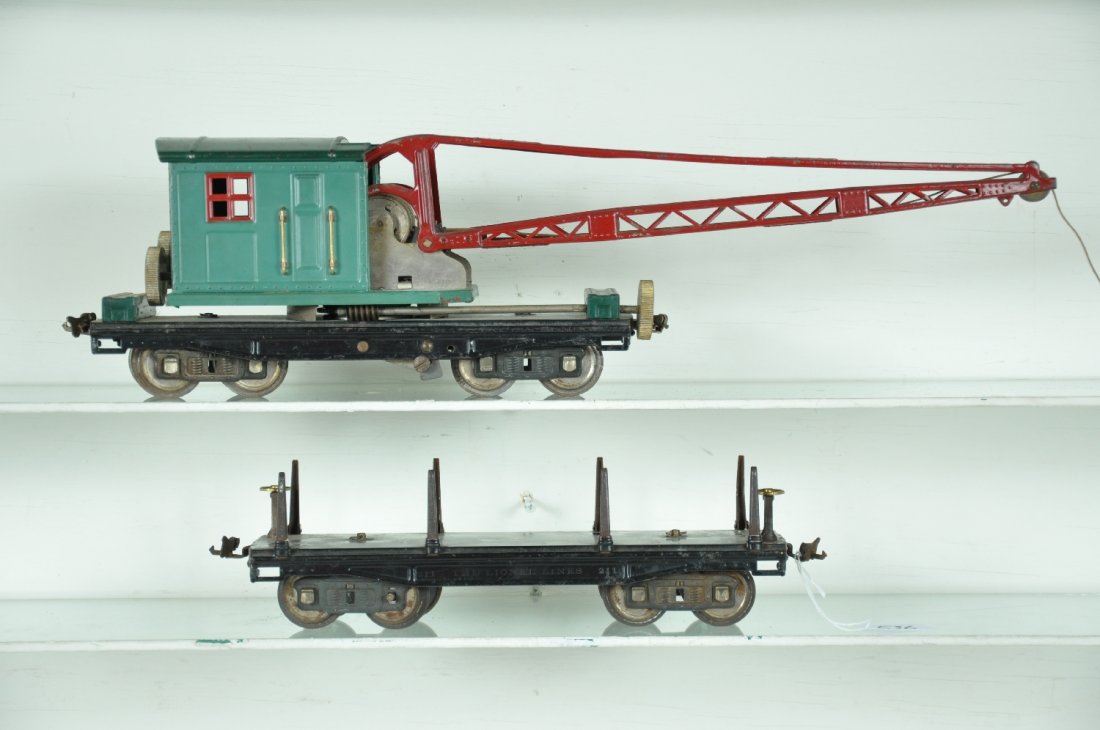 Lionel 211 & 219 Freight Cars: ST Gauge. Includes a 219 derrick, mechanism functions, missing hook; 211 lumber car, missing load. They show moderate playwear, C5-6