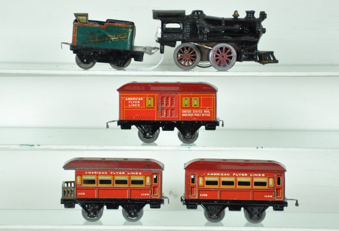 5Pc American Flyer Passenger Set: Circa 1925. Includes a 13 steam loco, mechanism is functional, motor housing is oxidized; 120 tender with back-up light; 1020 baggage; 1120 coach; 1120 observation. All show moderate playwear, clean &