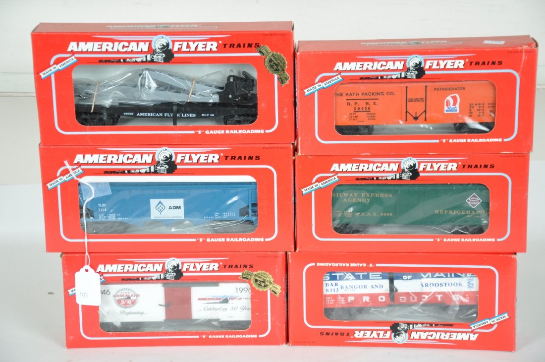 6 Lionel-American Flyer Freight Cars: S Gauge. Includes 48317 Rath reefer; 49009 flat with derrick; 48612 ADM hopper; 48806 REA reefer; 48324 1996 boxcar; 48313 B&A boxcar. All are new in boxes, C10