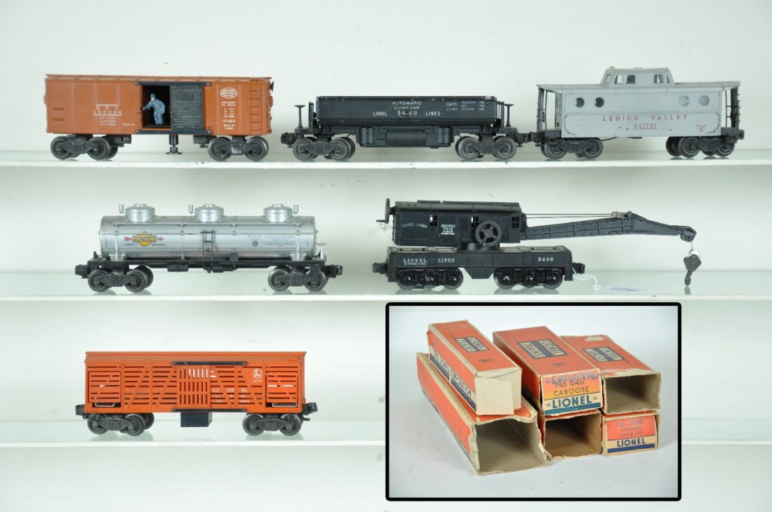 6 Boxed Lionel Freight Cars: Includes a 6417-50 LV N5c caboose; 2460 crane, hairline crack in 1 boom support; 3656 oper. Cattle car, only; 3464 NYC oper. boxcar; 6415 Sunoco tank car; 3460 coal dump. All are clean, showing modera
