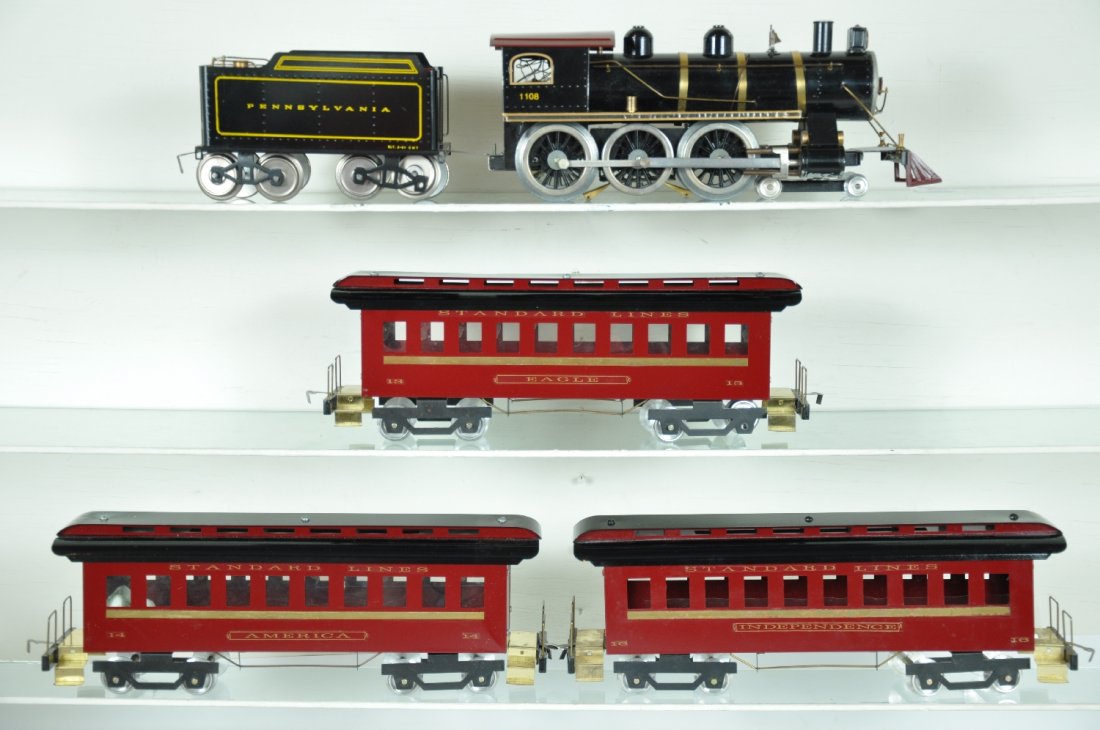 5Pc Classic Models PRR Train Set: ST. Gauge. One of Charlie Woods best. Includes a 1108 4-6-0 steam loco; PRR tender; Day coaches- Independence, Eagle & America. All are clean & shiny with some loose window inserts. They show very lig