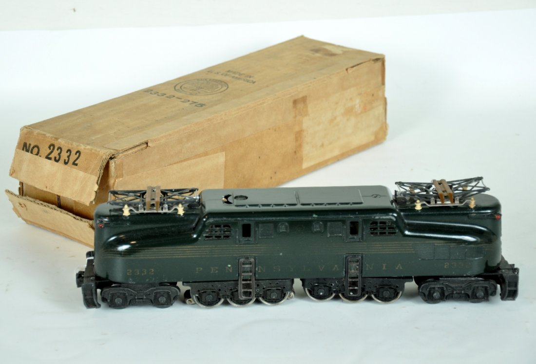 Boxed Lionel 2332 PRR GG1: Clean & very shiny with 85% stripes, just worn a bit in the middle. Rubber-stamped side keystones are visible, but light. It shows light runtime with box & insert, paint is C7-7+
